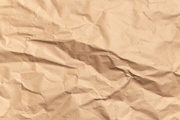 Crumpled brown paper texture. Kraft recycled paper background.