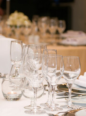 Luxurious table set for a celebration, wedding or event with glassware and cutlery