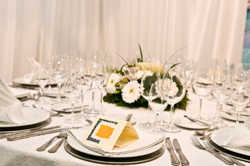 Luxurious table set for a celebration, wedding or event with glassware and cutlery