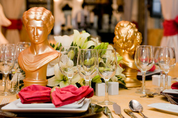 Luxurious table set for a celebration, wedding or event with glassware and cutlery