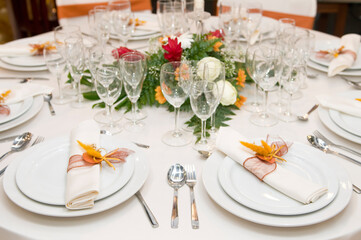 Luxurious table set for a celebration, wedding or event with glassware and cutlery