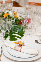 Luxurious table set for a celebration, wedding or event with glassware and cutlery