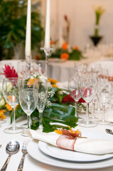 Luxurious table set for a celebration, wedding or event with glassware and cutlery