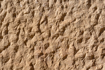 texture of a natural rough-cut stone of an ancient building