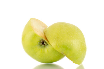 Two halves of a sweet green apple, close-up, isolated on white.