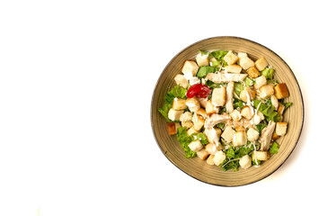 Fresh traditional Caesar salad, with chicken, on a white background,Top view, dark background, horizontal no people,
