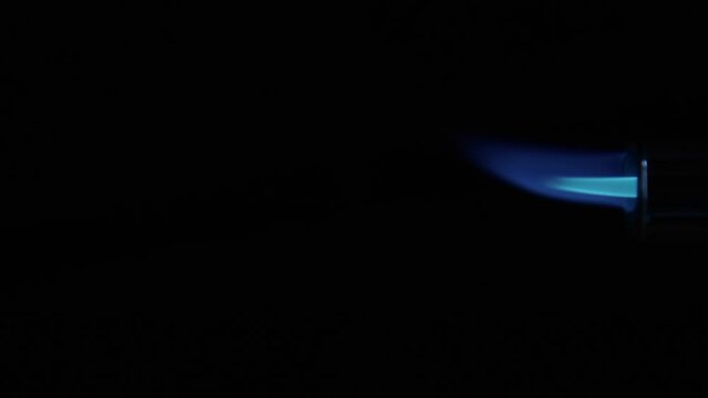Butane Gas Flame growing and shrinking from nozzle against black from a butane torch burner. Element for VFX and Compositing, e.g. as rocket propulsion, spaceship drive or welding flame