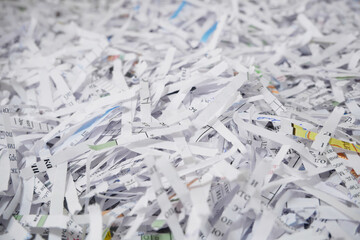 Shredded documents to protect confidential information, background, top view
