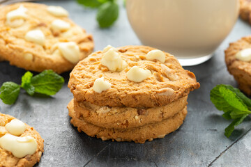 White Chocolate Caramel soft baked cookies served with glass of milk