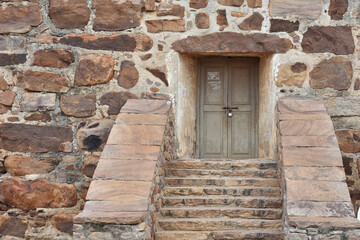old wooden door in the wall