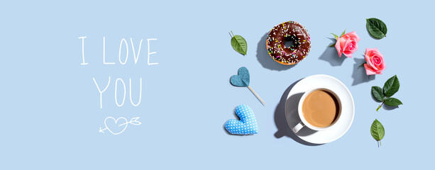 I love you message with a cup of coffee and a donut - flat lay