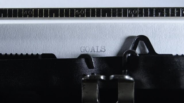 Typing GOALS with an old manual typewriter