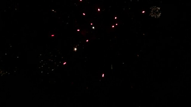 Christmas fireworks at night. 4k video abstract background. Copy space
