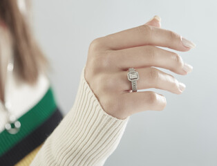 Diamond jewelry. Diamond rings on woman finger