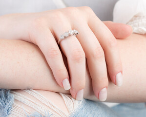 Diamond jewelry. Diamond rings on woman finger