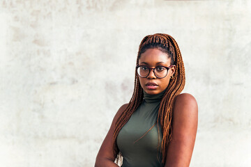 young african woman with glasses looking at camera