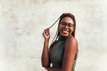 young african girl with glasses smiles happy