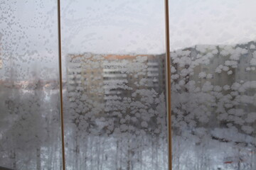 frosty patterns on window panes in winter