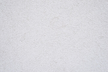 Rough plastered wall painted on white