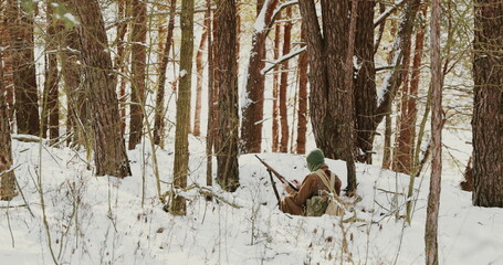 4K Re-enactor Dressed As American Soldier Of USA Infantry Of World War II Shooting From Rifle In...