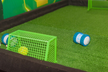 Fototapeta premium Mini Robot Scored a goal in a robot-controlled human match.