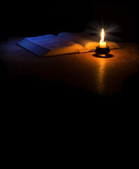 Still life from ancient book with candle