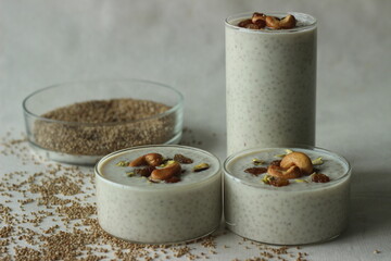 Kodo millet pudding. Rich creamy and sweet dessert garnished with ghee roasted raisins and nuts. An...