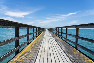 Long leading lines of never ending jetty on Motuihe Island , Auckland New zealand.