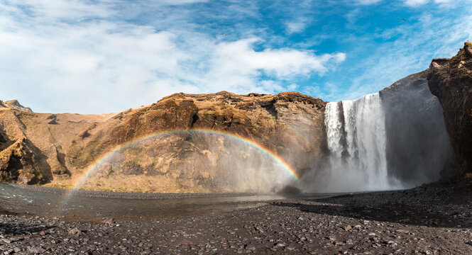 Skogafoss waterfall and rainbow in Iceland