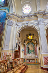 Fototapeta premium Guayaquil, Guayas, Ecuador - November, 2013: Interior of the Santo Domingo church (Saint Domingo), with its many decorations, statues, religious art, paintings, columns and stained glass windows
