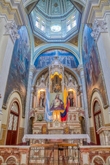 Fototapeta na wymiar Guayaquil, Guayas, Ecuador - November, 2013: Interior of the Santo Domingo church (Saint Domingo), with its many decorations, statues, religious art, paintings, columns and stained glass windows