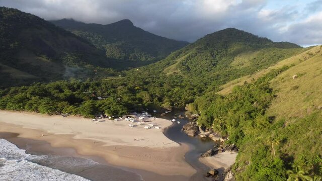 Tropical landscape with river, sand and mountains