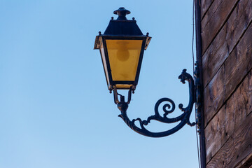 Fototapeta na wymiar Vintage iron lantern on a house wall
