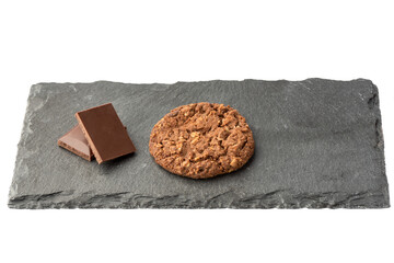 Granola cookies with chocolate and chocolate pieces on a stone board for serving.