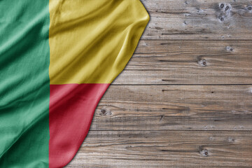 Wooden pattern old nature table board with Benin flag