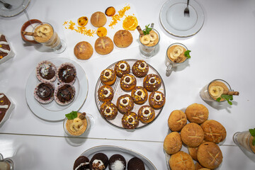 tiny cakes in orange caramel serving plate