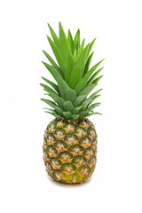 Ripe juicy pineapple on a white background close-up. Crested pineapple in a vertical photo against a white background. Delicious tropical sweet fruit