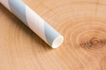 Paper drinking straw on wood