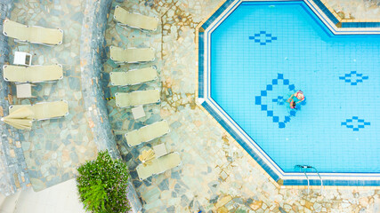 Top view of beg swimming pool. Blue water background.
