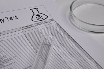Toxic test log with petri dish and glass tube. Paper logs for toxicology exams. Mortal records in...