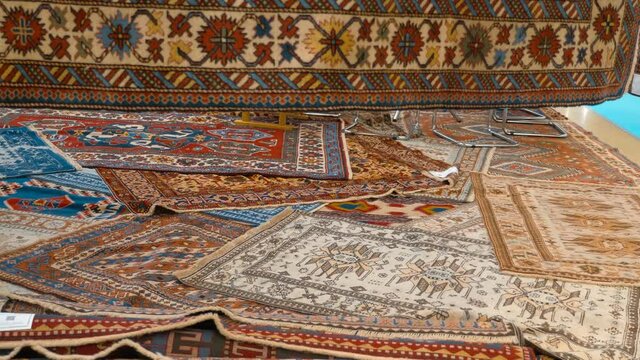 Beautiful handmade carpets from Asian countries are shown at the exhibition. Shot in motion. Closeup