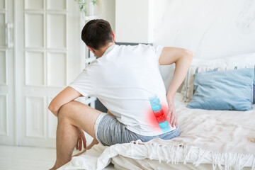 Lumbar intervertebral spine hernia, man with back pain at home, spinal disc disease - obrazy, fototapety, plakaty