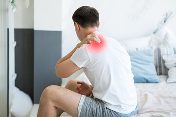Neck pain, man suffering from ache at home