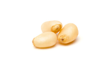 Siberian peeled pine nuts isolated on white background. Healthy nuts snacks. Clipping path, full...