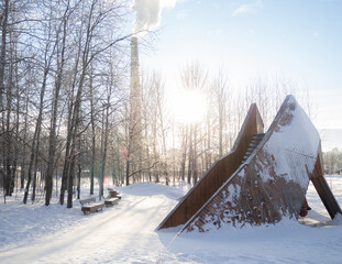 an unusual slide in the winter city park