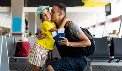 Obraz premium excited little girl with her father at airport after a long wait