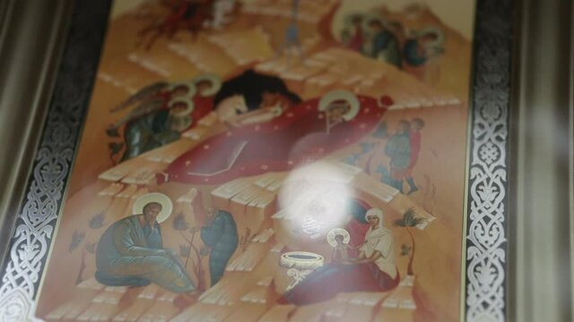 reflection of glare in an Orthodox icon, decoration of the church before Christmas