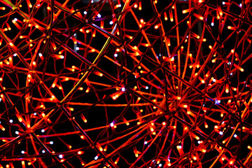 red abstract glowing lights and wire network on a black background
