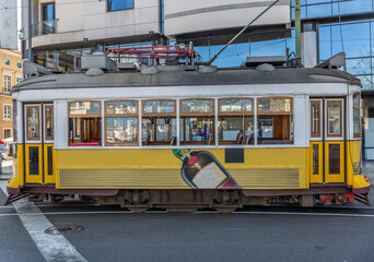 Fototapeta na wymiar Closeup of a typical yellow tram in the beautiful city of Lisbon