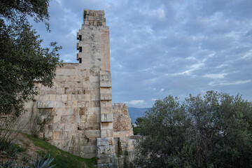 Evening sky with clouds against the background of the ruins of ancient greek architecture